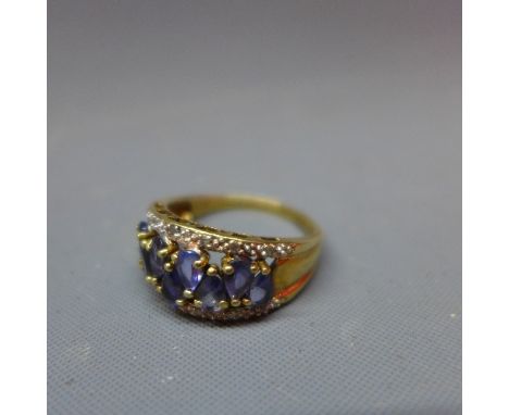 A 9ct carat yellow gold, amethyst and cubic zirconia dress ring