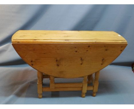 A contemporary pine gate leg drop leaf table. H-75cm, L-120cm 