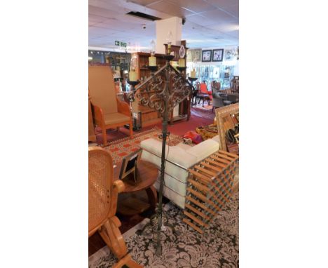 An Early 20th Century wrought iron standard lamp