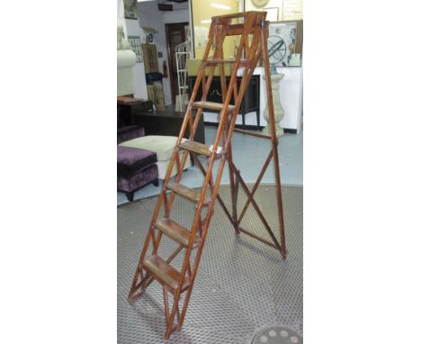 LIBRARY STEP LADDER, polished wood with six treads, 176cm H x 35cm W maximum. 