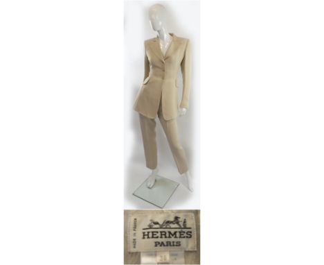 HERMÈS TROUSER AND JACKET SUIT, in nude, three button fastening on fitted jacket, shoulder pads, two front pockets, notched l