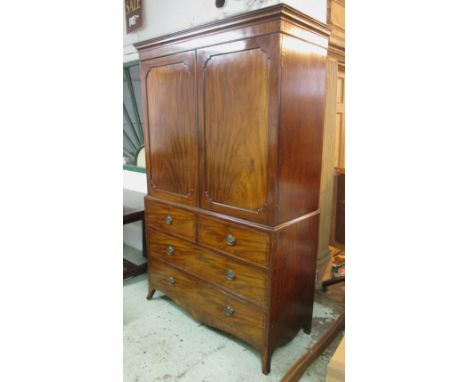 LINEN PRESS, Regency mahogany with a pair of panelled cupboard doors above enclosing sliding trays over two short and two lon