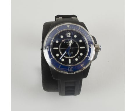 CHANEL J12 WRISTWATCH, black ceramic cased with blue bezel with still rim and still crown with rubber strap, cased and boxed.