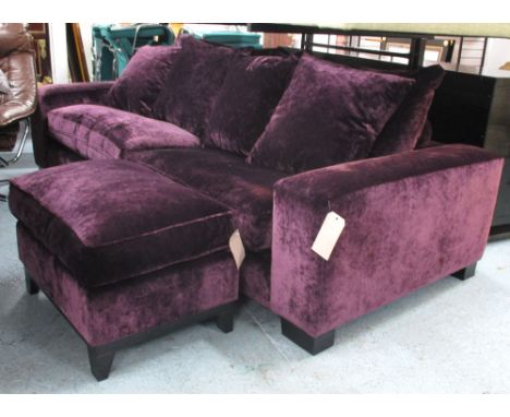 SOFA, in plum velvet upholstery with footstool, 246cm W x 108cm x 89cm H. (2)