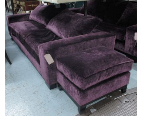 SOFA, in plum velvet upholstery with footstool, 246cm W x 108cm x 89cm H. (2)