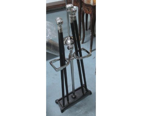 STICK STAND, in chromed metal with weighted base and four walking canes, 70cm H. (5)