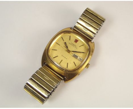 OMEGA MEGAQUARTZ.A gentleman's Omega Megaquartz wristwatch, with gold coloured dial, red lacquered Omega logo, day & date ape
