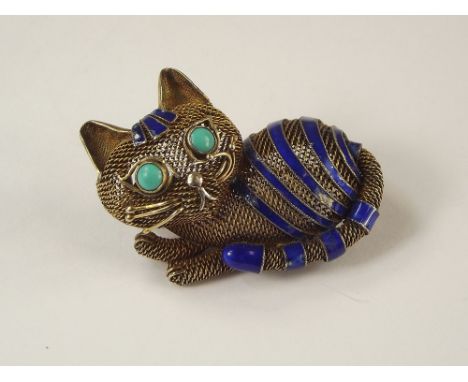 CAT BROOCH. A silver gilt filigree &amp; blue enamel cat brooch, set with turquoise eyes. 4cm.