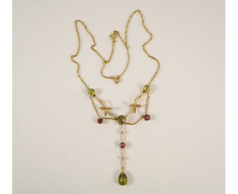 EDWARDIAN NECKLACE. A 15ct. gold peridot, pink topaz &amp; seed pearl necklace. Length of drop 4.5cm.