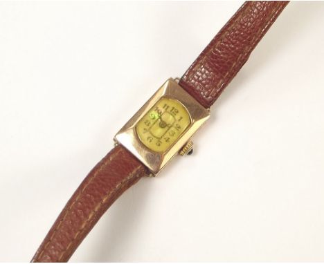 GOLD WATCH. A lady's 1930's 9ct. rose gold cased wristwatch, with mother of pearl dial &amp; sapphire set crown. Later leathe