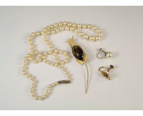 PEARLS ETC.A graduated cultured pearl necklace, a cat brooch set with cat's eye & two single gold mounted earrings.