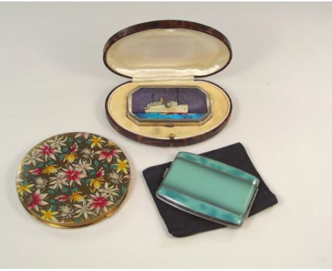 POWDER COMPACTS.A 1920's powder compact, the lid with butterfly wing & decorated with the liner Atlantis, in original box. Al