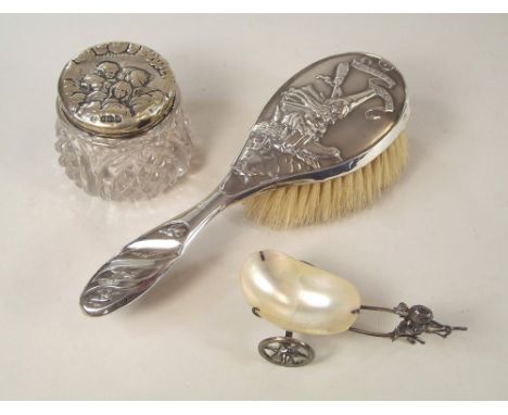 CHILD'S BRUSH ETC.A silver mounted child's hair brush embossed with Mother Goose, Birmingham 1911 (a.f.), a silver topped, mo