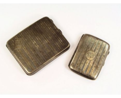 CIGARETTE CASES. A 1920's curved, engine turned cigarette case &amp; a smaller, earlier cigarette case.