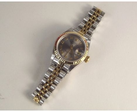 LADY'S ROLEX. A lady's steel &amp; gold Rolex Oyster Perpetual Datejust wristwatch, c.2000. The dial, brushed steel with Roma
