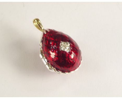 THEO FABERGE. A red enamel egg pendant from the St. Petersburg collection, by Theo Faberge. With 18ct. gold suspension loop &