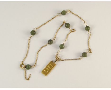 GOLD PENDANT. A gold ingot pendant, stamped '24KT' on a 14ct. gold &amp; jade bead chain (chain needs repair).