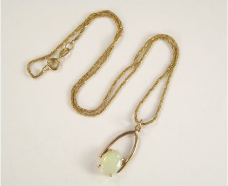 OPAL PENDANT. An opal pendant on 9ct. gold chain. Length of drop 2.5cm.