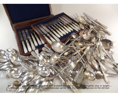 FLATWARE.A set of twelve dessert knives & forks with mother of pearl handles, in mahogany case (case a.f.) & a large collecti