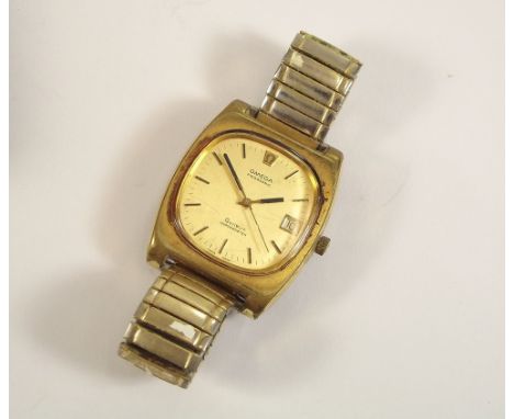 OMEGA MEGASONIC. A gentleman's Omega Megasonic wristwatch, in gold plated case. The gold coloured dial with baton numerals, d