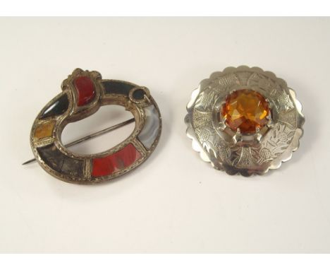 HARDSTONE JEWELLERY ETC. A Victorian hardstone set brooch (a.f.), &amp; an engraved white metal cloak brooch, set a citrine.