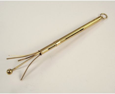 SWIZZLE STICK. A 9ct. gold swizzle stick.