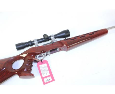 A Ruger 10-22 .22 R/F Cal. self loading rifle with custom stock. Three magazines and a 3- 9 x 40 scope Ser.No.245/65554.
This