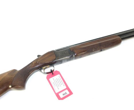 A 12 bore over and under shotgun by Miroku Ser.No.736908. 26" barrels with good bores, selective safety and single trigger. A