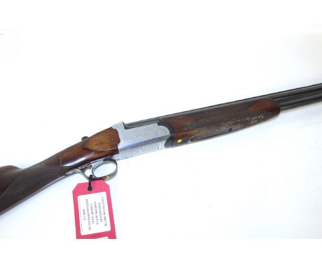 A Marocchi 12 bore over / under shotgun with single trigger and 27¾" barrels having good bore. Ser.No.118126
This item can on