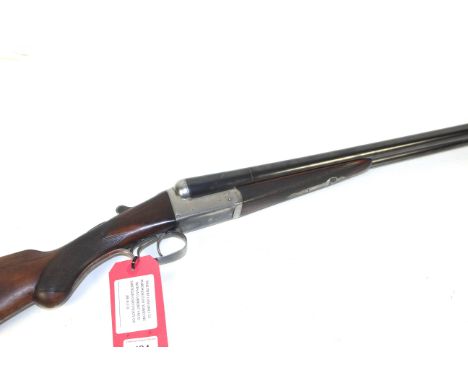 A 12 bore side-by-side B.L.N.E. shotgun by Hawkes, having 28" barrels with good bores. Ser.No. 15014.
This item can only be p