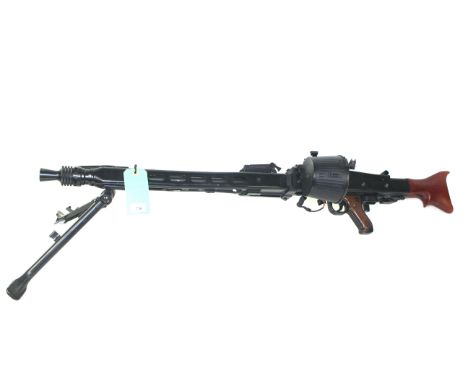 An Airsoft AGM MG42 G.P.M.G.in black with drum magazine, spare battery and charger.
As a post 1939 air weapon the restriction