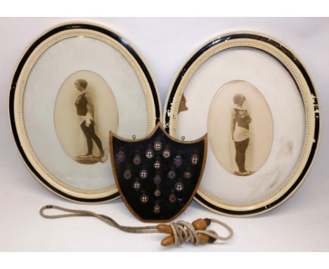 Collection of early 20th century silver and enamel gymnastics medals mounted on shield shaped board, gross weight 6.1ozt, tog
