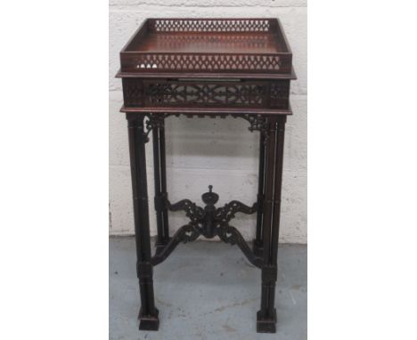 Chippendale style mahogany urn stand, galleried top and frieze on cluster column supports joined by pierced stretcher with ur