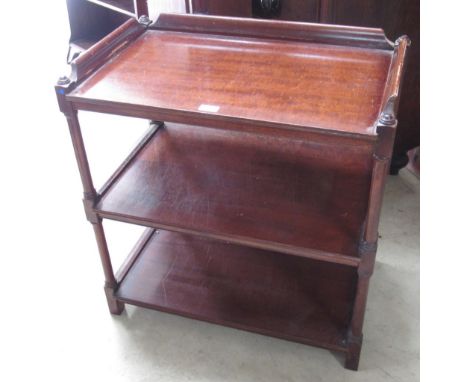 C20th mahogany three tier buffet, galleried top on turned supports, W70cm D42cm H74cm 