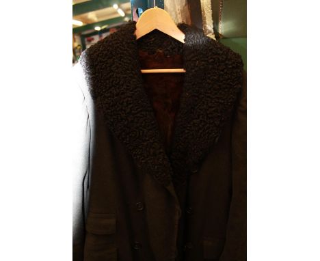 Two long mink coats, one long dark brown mink fur and one black overcoat with full mink lining and a black fur collar (2) 