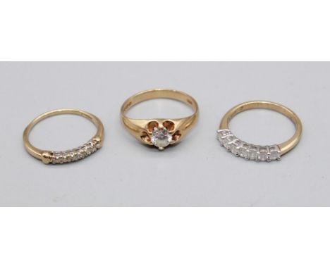 15ct yellow gold ring set with a row of diamonds, stamped 15, size P, 1.8g, a 9ct yellow gold ring set with a row of seven di