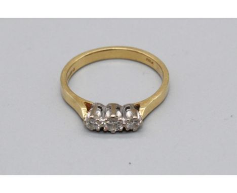 18ct yellow gold three stone diamond ring, stamped 750, size M, 2.8g 