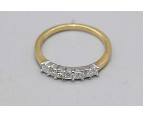 18ct yellow gold ring set with row of seven square cut diamonds, stamped 750, size M, 2.4g 