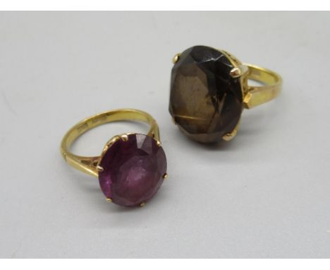 14ct yellow gold ring set with smoky quartz, stamped 14k, size J, and an 18ct yellow gold ring set with purple stone, stamped