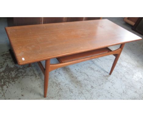 G-Plan style mid C20th teak rectangular coffee table on tapered supports, with magazine shelf undertier, L123cm D53cm H47cm 