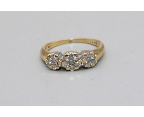 18ct yellow gold ring set with three diamond clusters, stamped 18, K1/2, 3.0g 