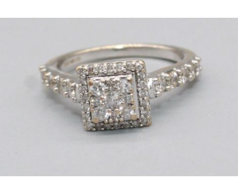 18ct white gold square faced ring set with brilliant cut diamonds, on diamond set shoulders, stamped 750, size K, 3.6g 