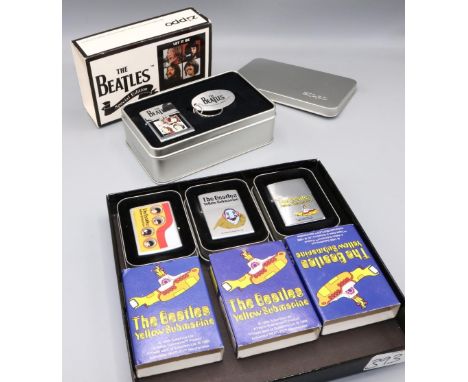 Zippo lighters, The Beatles: three 'Yellow Submarine' editions, and a 'Let it Be, Special Edition' lighter and keyring, all w