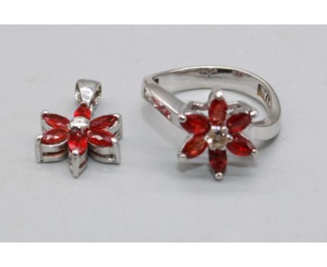 18ct white gold necklace set with diamond and ruby floral cluster ring, size M, and matching pendant, stamped 750, 6.8g 