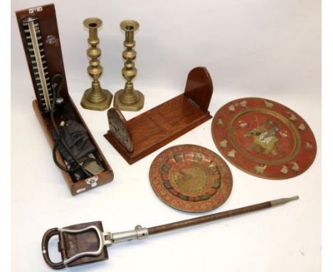 Various collectables, comprising a pierced metal decorated oak book slide, two Indian brass and enamel plates, beehive candle