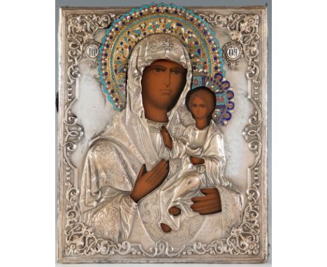 Russian icon from the end of the 19th century."Virgin Odighitria".Painting on wood. Silver oklad and enamels. Cloth on the re