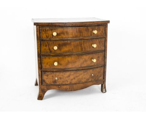 Nineteenth Century Apprentice Chest of Drawers, a bow front mahogany chest of four long drawers with turned horn pulls (two d