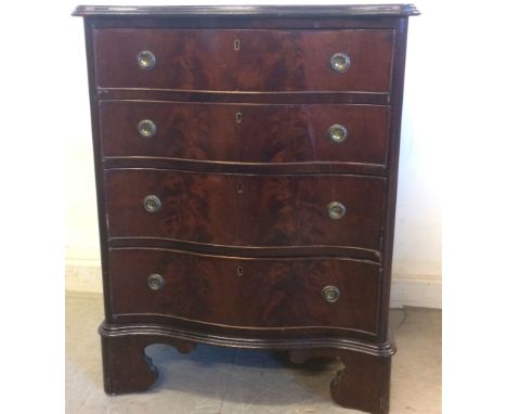 An early 20th Century Chippendale style mahogany serpentine front chest of drawers,  with shaped top with moulded edges, four