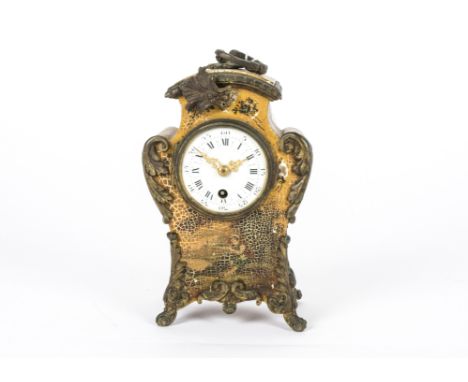 An early 20th Century French mantel clock, of curved form, decorated with painted figures and flowers upon a gilt backdrop, w