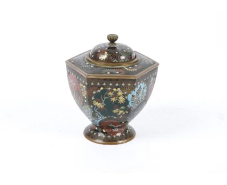 A Japanese Meiji period lidded hexagonal topped jar with cloisonné enamel decoration,  with circular bands forming the upper 